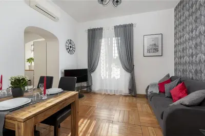 a living room with a couch and a table at Take You Rome - Vatican Apartment in Rome