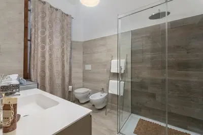 a bathroom with a tub and a toilet and a shower at Take You Rome - Vatican Apartment in Rome