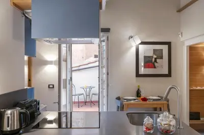 a kitchen with a sink and a counter top at Flat PIAZZA DEL POPOLO in Rome