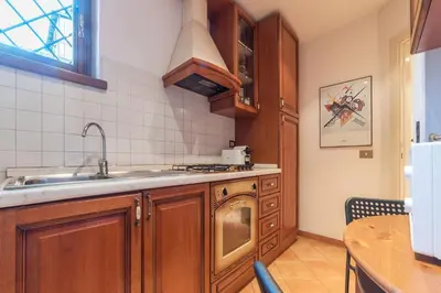 a kitchen with a sink and a dishwasher at Amazing studio in Campo de Fiori - FromHometoRome in Rome