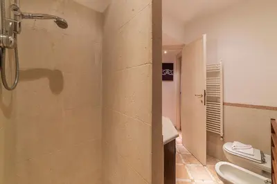 a bathroom with a shower and a toilet at Amazing studio in Campo de Fiori - FromHometoRome in Rome