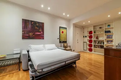 a bedroom with a bed and a desk in it at Apartment with terrace near Piazza Navona - FromHometoRome in Rome