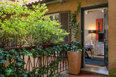 a balcony with plants on the side of a house at The Inn at the Spanish Steps Luxury Collection - Premium Studio Room in Rome