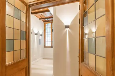 a hallway with a door and glass wall at Campo de' Fiori 34 in Rome