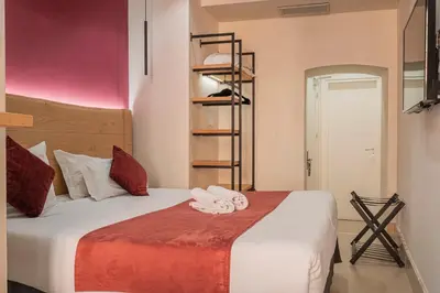 a bedroom with a bed with towels on it at Campo de' Fiori 34 in Rome