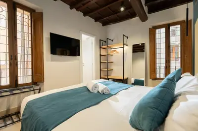 a bedroom with a bed with two pillows on it at Campo de' Fiori 34 in Rome