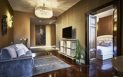 two yellow chairs in a room with wood floors at The Inn at the Spanish Steps Luxury Collection - The Club Condotti 91 in Rome