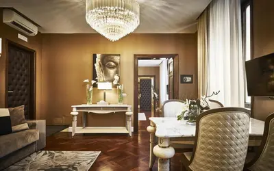 a living room with a couch and a mirror at The Inn at the Spanish Steps Luxury Collection - The Club Condotti 91 in Rome