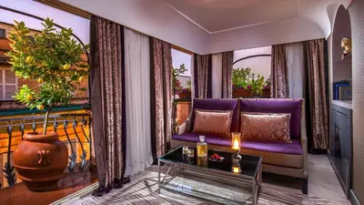 a room with a desk on a balcony with plants at The Inn at the Spanish Steps Luxury Collection - The Club Condotti 91 in Rome