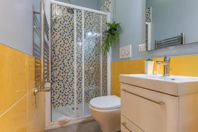 a bathroom with a shower and a toilet and a sink at Kitty Apartment - Close to the Vatican in Rome