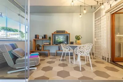 a living room with a table and chairs at Kitty Apartment - Close to the Vatican in Rome