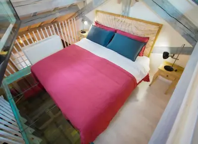 an overhead view of a bed in a room at Rosso Cortese in Rome