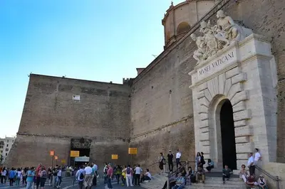 a group of people standing outside of a building at Domus Vatican Museum in Rome
