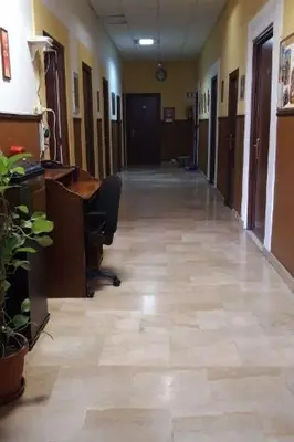 an empty hallway of an office building with a hallway at Ostello Marello in Rome
