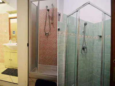 a bathroom with a shower with a glass door at Ostello Marello in Rome
