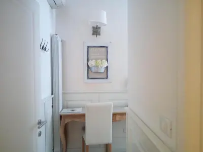 a white room with a desk and a white chair at Alba Sul Vaticano in Rome