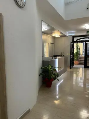 a hallway of a building with a plant in it at Villa Angeli in Rome