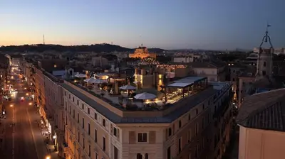 an aerial view of a city at sunset at Navona Queen Rooftop in Rome