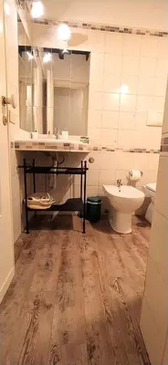 a bathroom with a sink and a toilet at Sweet Home Panisperna in Rome