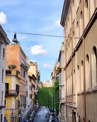 a city street with cars parked on the street at Sweet Home Panisperna in Rome