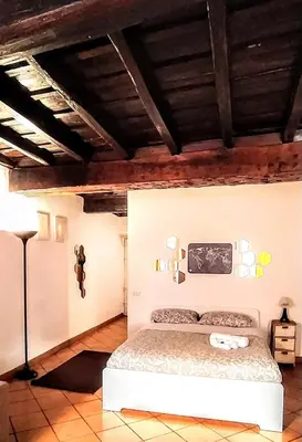 a bedroom with a bed in a room at Sweet Home Panisperna in Rome