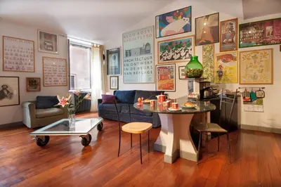 a living room with a table and a couch at DomusAmor Navona in Rome
