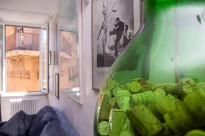 a large green vase sitting next to a wall at DomusAmor Navona in Rome