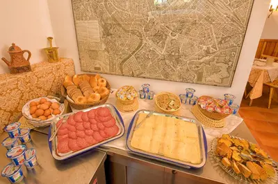 a table topped with lots of different types of food at Gästehaus Deutscher Orden in Rome
