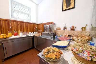 a kitchen with a counter with some food on it at Gästehaus Deutscher Orden in Rome
