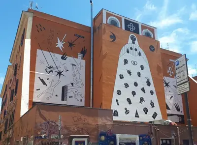 a building with a christmas tree painted on it at A casa di Rosanna in Rome