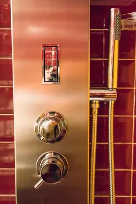 a stainless steel refrigerator with two pots and pans at Ripetta Rooms in Rome