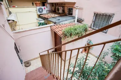 a staircase in a building with plants at Colosseum/Panisperna Nina apartament with terrace in Rome