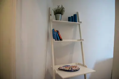 a kitchen with a table and a dining room at Colosseum/Panisperna Nina apartament with terrace in Rome