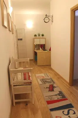 a living room with a chair and a table at Home 103 in Rome