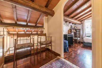 a bedroom with two bunk beds in a room with wooden ceilings at Quiet and classic on two floors, by Trevi Fountain - FromHometoRome in Rome