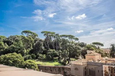 a view of a park with trees and buildings at Roof top dream piazza del popolo in Rome