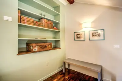 a hallway with shelves and a bench and a light at Roof top dream piazza del popolo in Rome