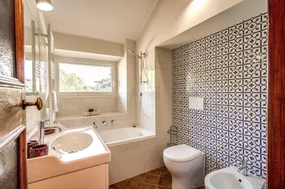 a bathroom with a sink and a toilet and a tub at Roof top magic Piazza del Popolo in Rome