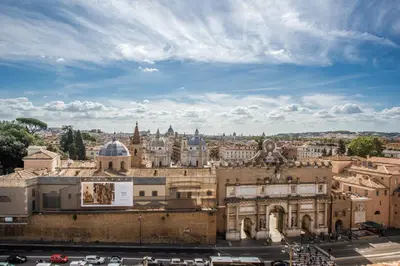 a view of the city from the roof of a building at Roof top magic Piazza del Popolo in Rome