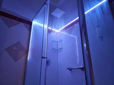 a shower with a glass door in a bathroom at Anthony Guesthouse in Rome