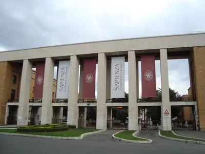 a building with red and white banners on it at Anthony Guesthouse in Rome