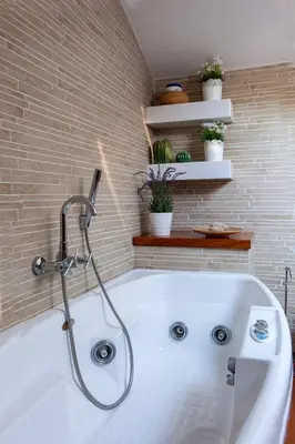 a bath tub with a shower in a bathroom at I Villini del Pigneto in Rome