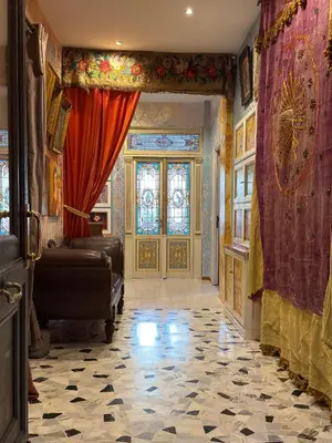 a large room with a door and curtains and a room with a floor at Rome Museum House in Rome