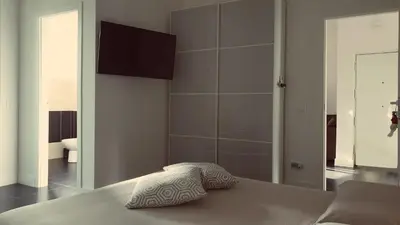 a bedroom with a bed with two pillows on it at Efeso 19 in Rome