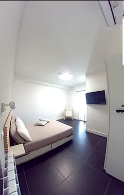 a room with a bed and a tv in it at Efeso 19 in Rome