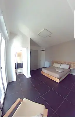 a bedroom with a bed and a purple tile floor at Efeso 19 in Rome