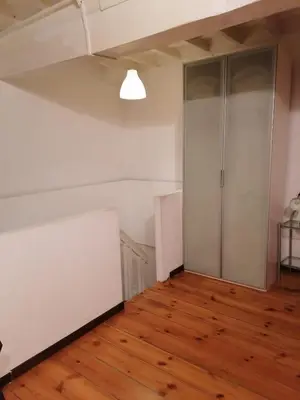 an empty room with a closet and wooden floors at Coronari 45 apartment in Rome