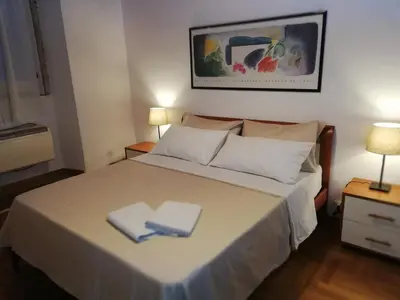 a bedroom with a bed with two napkins on it at Coronari 45 apartment in Rome
