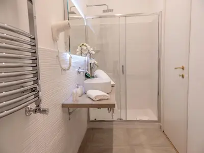 a bathroom with a sink and a shower at Vatican Palace Suites by Premium Suites Collection in Rome