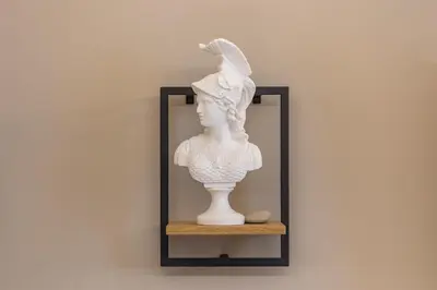 a white bust of a woman on a shelf at DrsRome - Roman's Ruins Colosseum in Rome